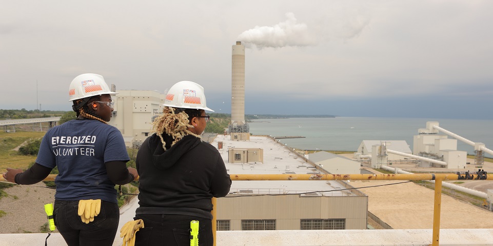 students overlooking Oak Creek Power Plant